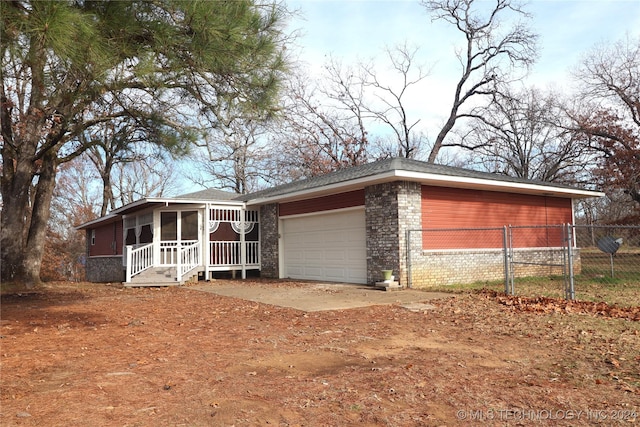 ranch-style home featuring a garage