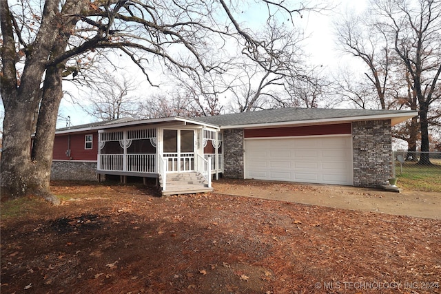 view of front of property with a sunroom