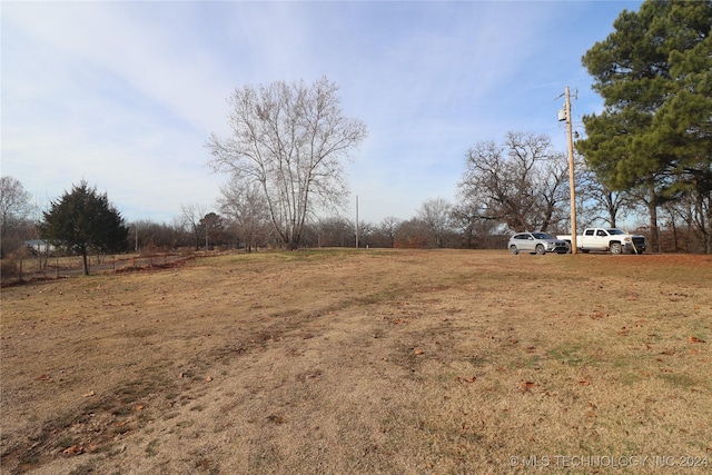 view of yard with a rural view