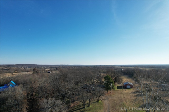 birds eye view of property featuring a rural view