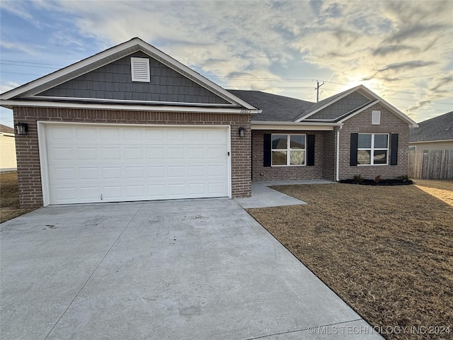 ranch-style house featuring a garage