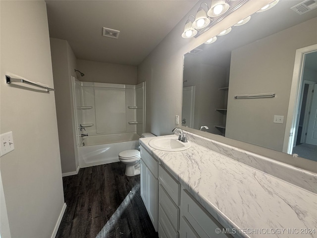 full bathroom featuring shower / tub combination, vanity, wood-type flooring, and toilet