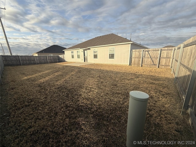 back of property with a patio area