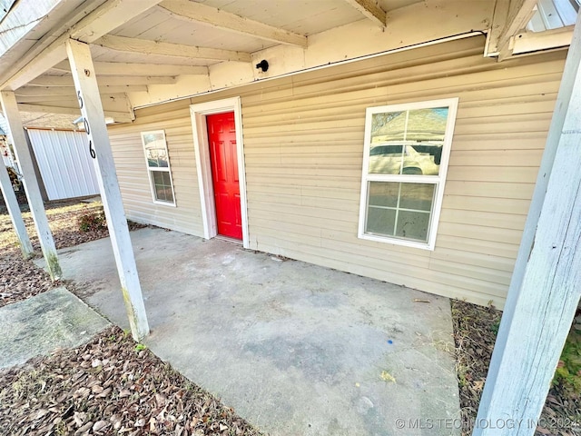 entrance to property with a patio