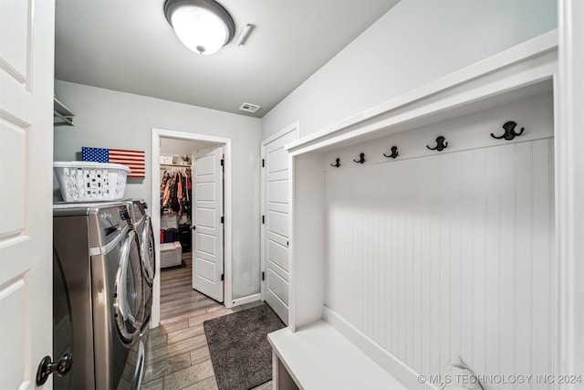 washroom featuring light wood-type flooring and separate washer and dryer