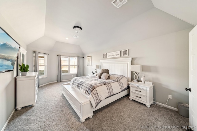 carpeted bedroom with lofted ceiling