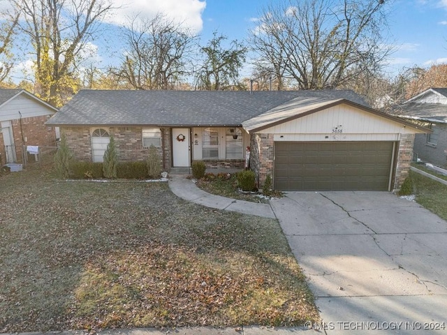 ranch-style home featuring a garage