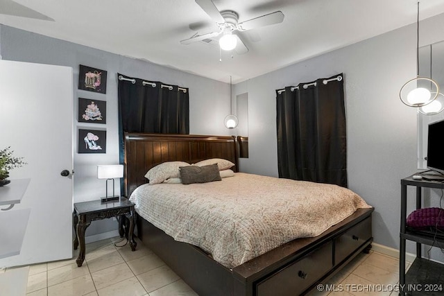 tiled bedroom with ceiling fan