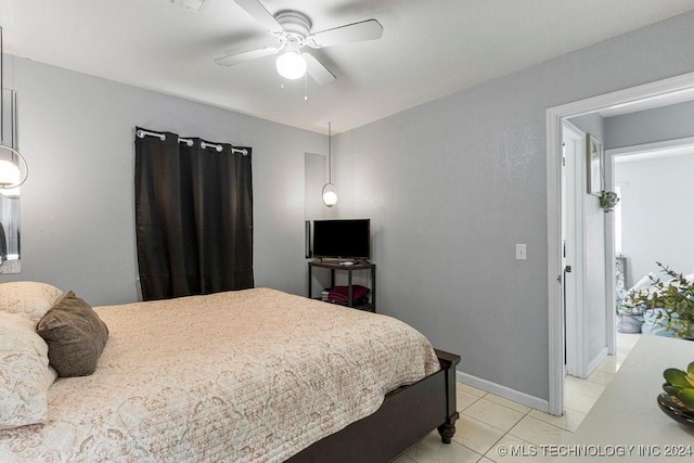 tiled bedroom with ceiling fan