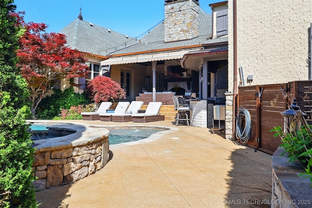 10616 S Forest Ave, Jenks, OK 74037 - rear view of house featuring fence, a patio, a chimney, and roof with shingles