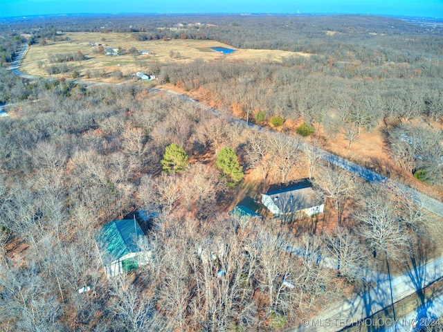 birds eye view of property featuring a rural view