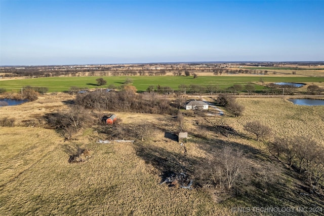 drone / aerial view featuring a rural view and a water view