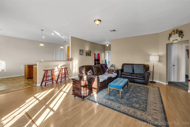 living room with light hardwood / wood-style flooring