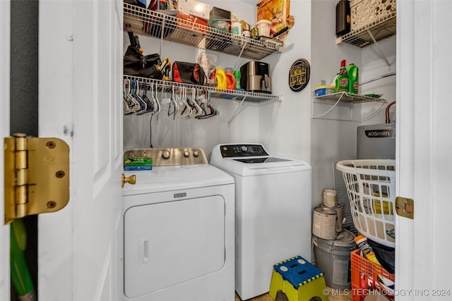 clothes washing area with washer and clothes dryer