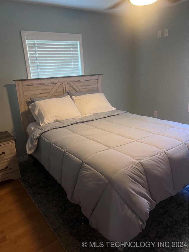 bedroom featuring wood-type flooring