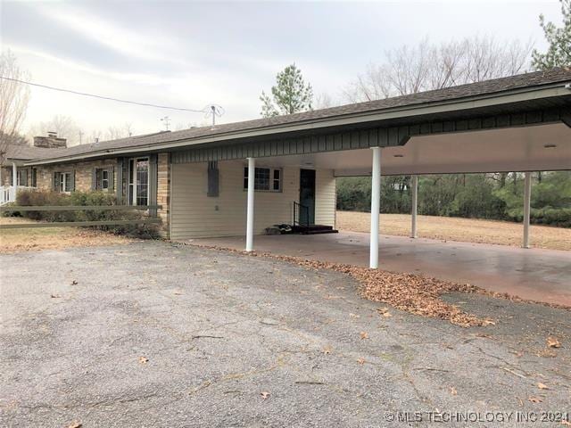 exterior space featuring a carport