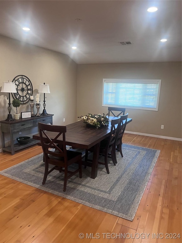 dining room with hardwood / wood-style floors