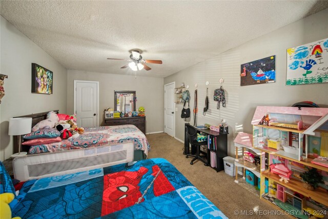 carpeted bedroom with ceiling fan and a textured ceiling