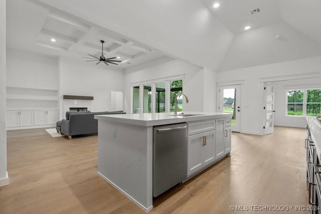 kitchen with dishwasher, a center island with sink, a healthy amount of sunlight, and light hardwood / wood-style floors