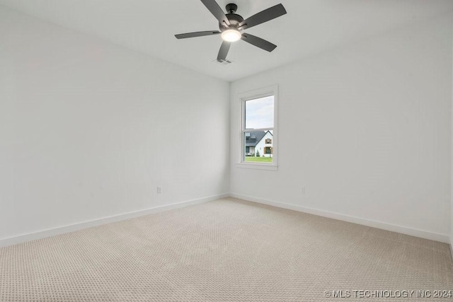 carpeted empty room with ceiling fan