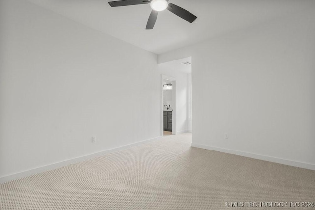 carpeted empty room with ceiling fan