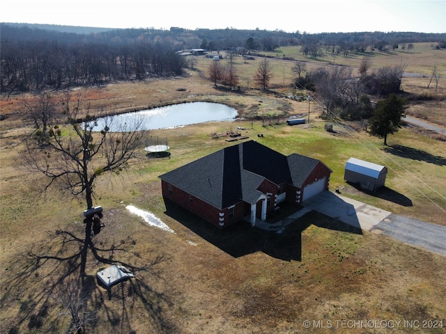 birds eye view of property featuring a rural view and a water view