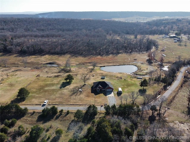 birds eye view of property with a rural view and a water view