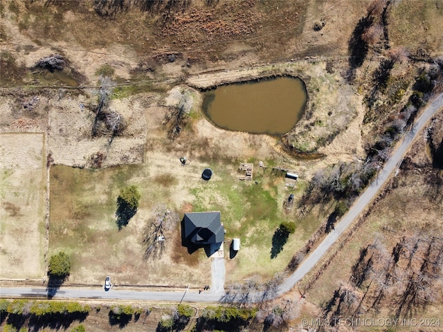 birds eye view of property with a rural view and a water view