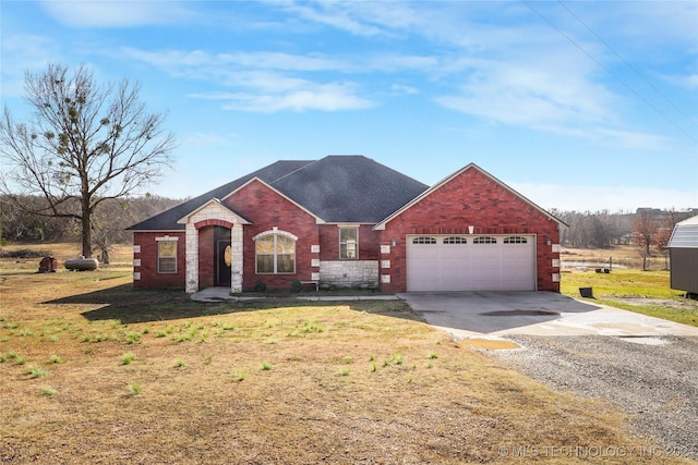 view of front facade with a front yard and a garage