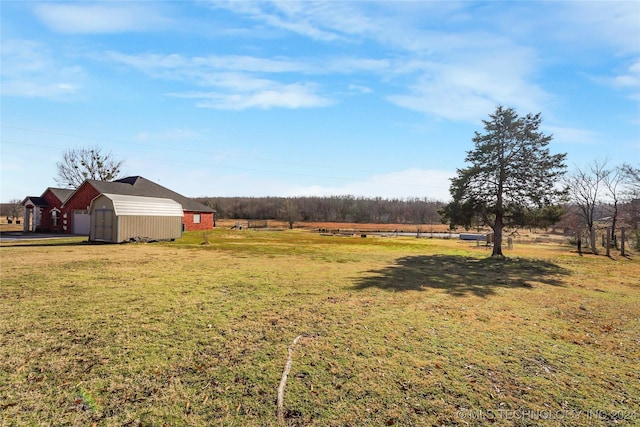 view of yard with a rural view