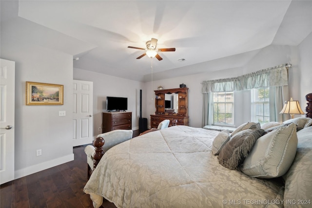 bedroom featuring lofted ceiling, ceiling fan, and dark wood-type flooring