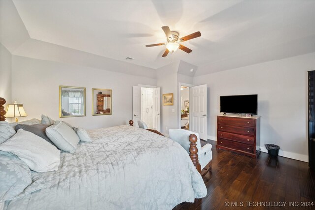 bedroom featuring ceiling fan and dark wood-type flooring