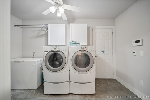 washroom with washing machine and dryer, ceiling fan, light tile patterned floors, and cabinets