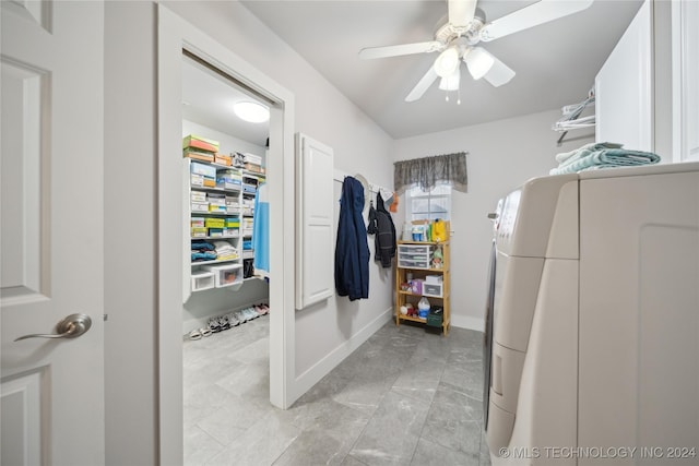 laundry room featuring ceiling fan and separate washer and dryer