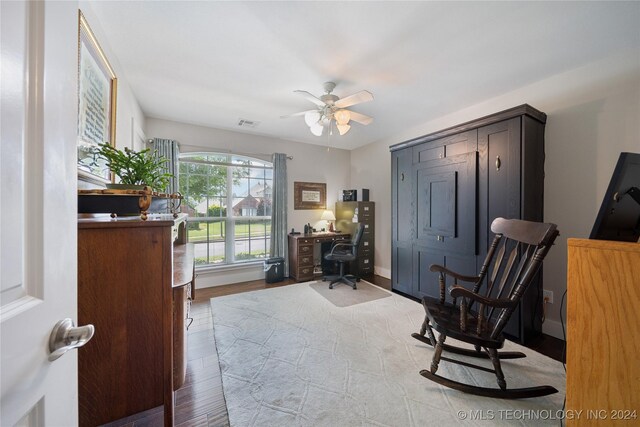 office space featuring ceiling fan and light hardwood / wood-style flooring