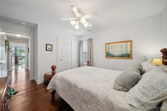 bedroom featuring ceiling fan and dark hardwood / wood-style flooring