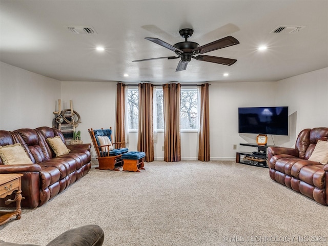 living room featuring carpet flooring and ceiling fan