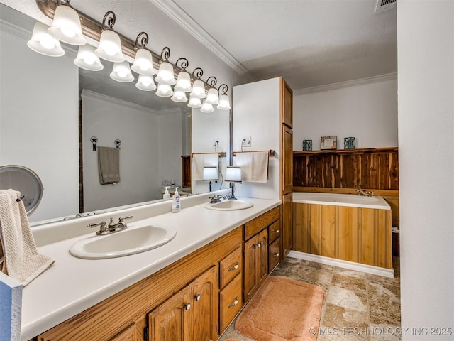 bathroom featuring crown molding and vanity