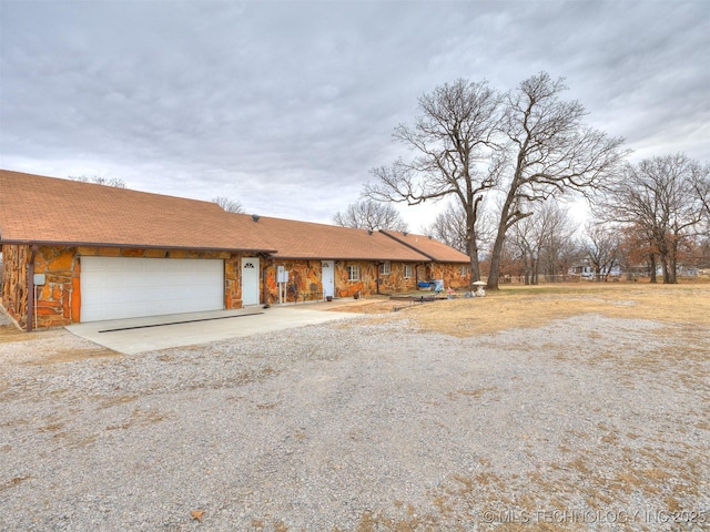 single story home with a garage