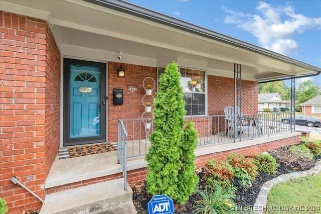 property entrance with a porch