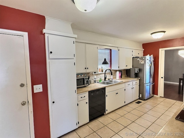 kitchen with white cabinetry, sink, decorative backsplash, light tile patterned flooring, and appliances with stainless steel finishes