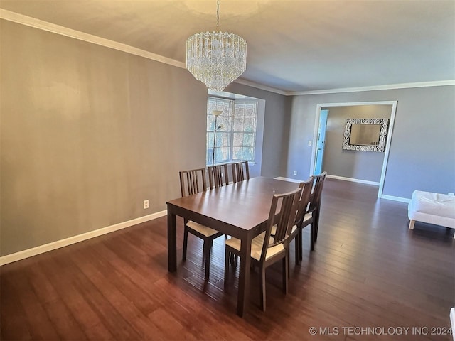 dining space with dark hardwood / wood-style flooring, an inviting chandelier, and crown molding