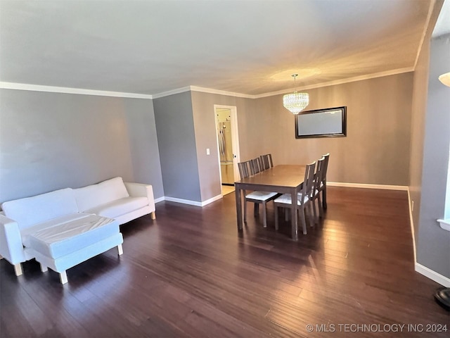 dining room featuring a chandelier, crown molding, and dark wood-type flooring