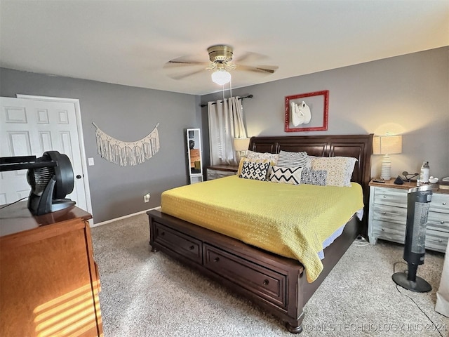 bedroom with ceiling fan and carpet floors