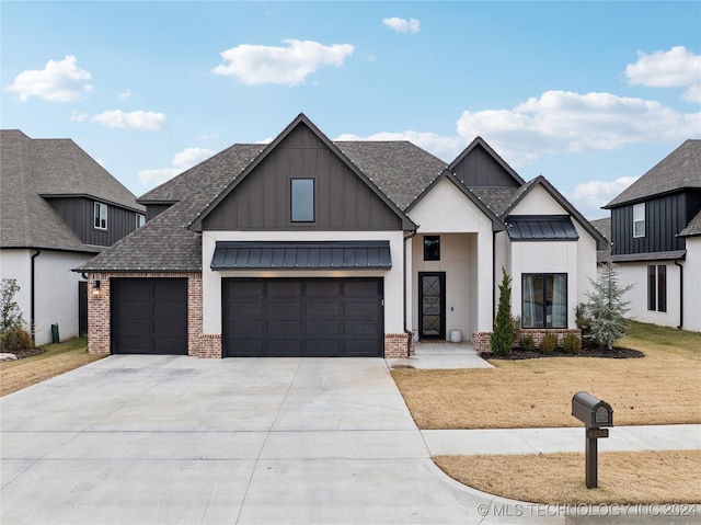 4255 S 173rd E Ave, Tulsa, OK 74134 - modern farmhouse style home with an attached garage, concrete driveway, board and batten siding, and brick siding