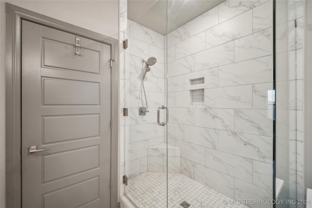 bathroom with an enclosed shower