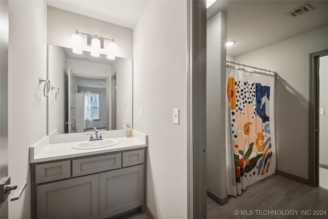 4255 S 173rd E Ave, Tulsa, OK 74134 - bathroom with vanity, tile patterned floors, and curtained shower