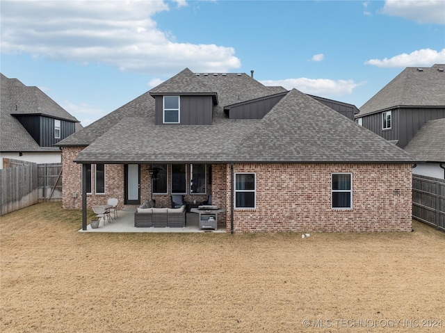 4255 S 173rd E Ave, Tulsa, OK 74134 - back of property featuring a shingled roof, a patio, outdoor lounge area, and brick siding