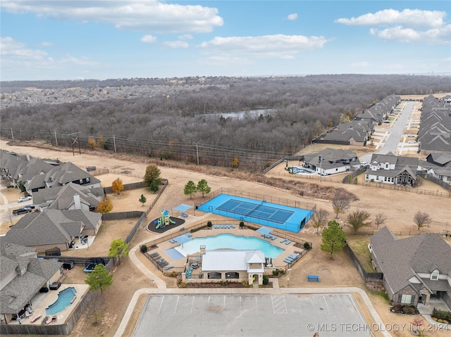 4255 S 173rd E Ave, Tulsa, OK 74134 - aerial perspective of suburban area featuring a pool and a forest