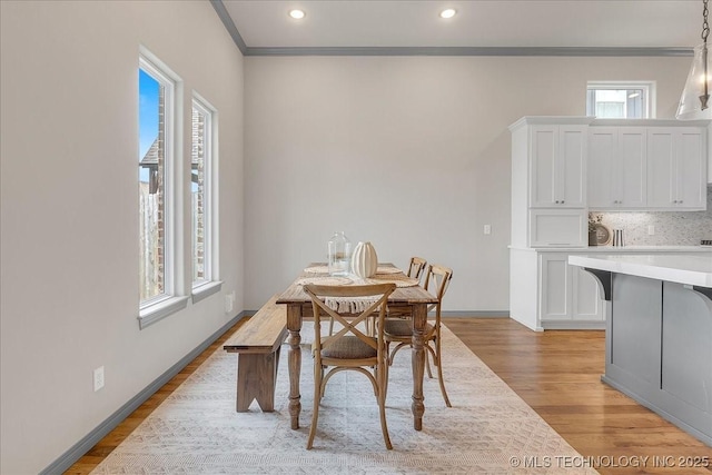 4255 S 173rd E Ave, Tulsa, OK 74134 - dining space with light wood-type flooring, crown molding, and recessed lighting